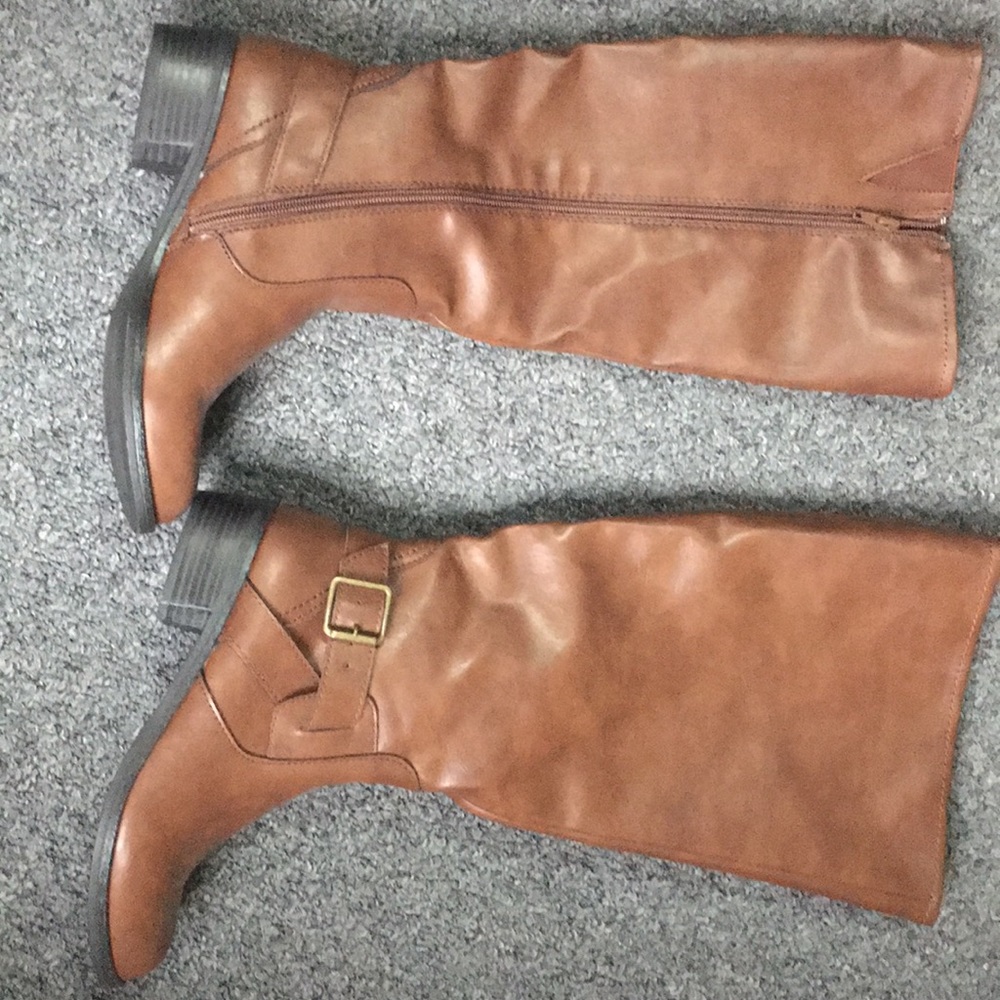 Tall riding boots. Never worn.